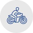 A blue line icon depicting a person riding a motorcycle. Represents the concept of motorcycle accidents - Sharks At Law